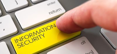 a yellow information security button on a keyboard.